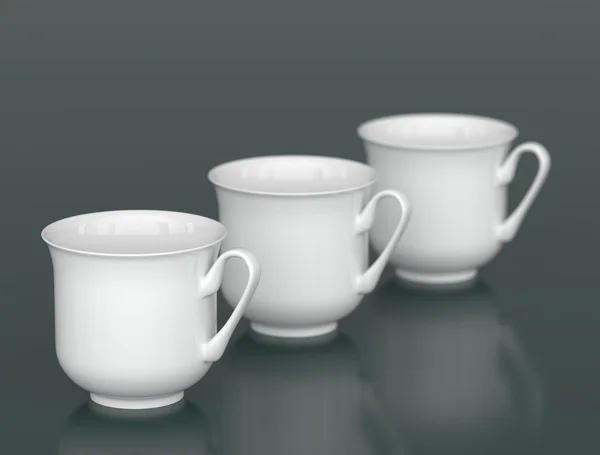 Три белые фарфоровые чашки в ряд с DOF — стоковое фото