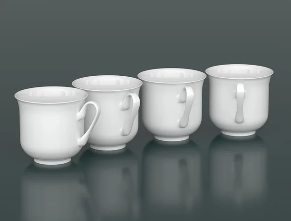 Чотири порцелянові чашки, розташовані дугою — стокове фото