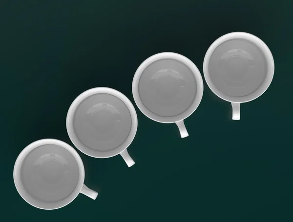 Четыре фарфоровые чашки помещены в дугу, вид сверху — стоковое фото