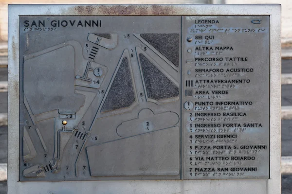 Metallic plaque near San Giovanni in Laterano. Rome, Italy
