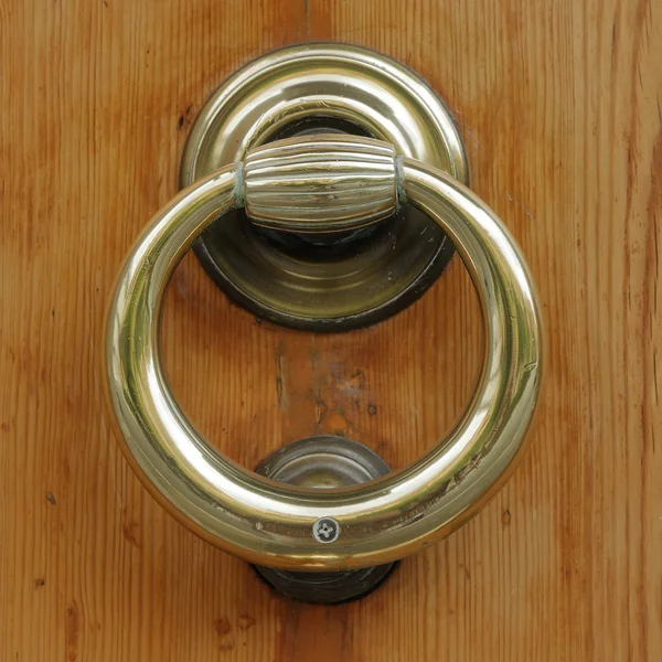 Wooden door with old bronze handle — Stock Photo, Image