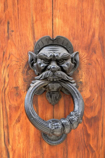 Dark wooden door with black dusty handle — Stock Photo, Image