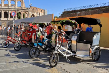 Four pedicab waiting for tourists in Rome, Italy