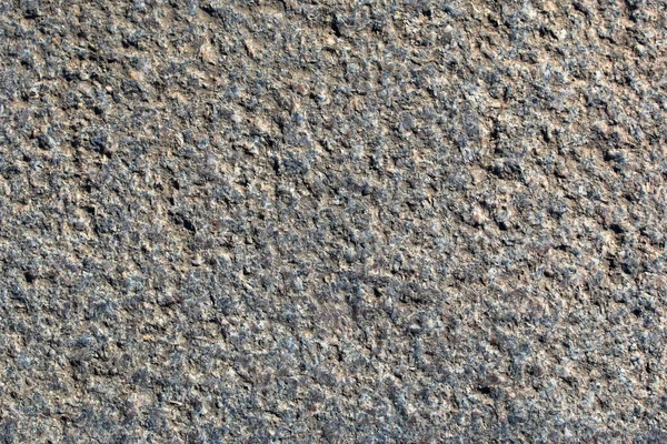 Textur einer alten rauen Granitoberfläche in Nahaufnahme — Stockfoto
