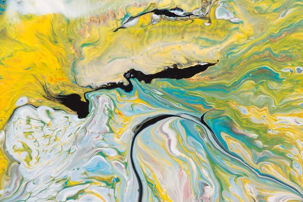 Parlak renkli, parlak efektli mermer. Sarı ve mavi renkli akışkan.