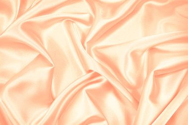   Pembe kremalı şeftali arkaplanı. Kumaşta yumuşak dalgalı kıvrımlar. Şefkatli. Düğün, sevgililer günü konsepti. Ya da bebek, yeni doğan tebrik kartı. Tasarım için kopya alanı olan narin bir arkaplan.                             