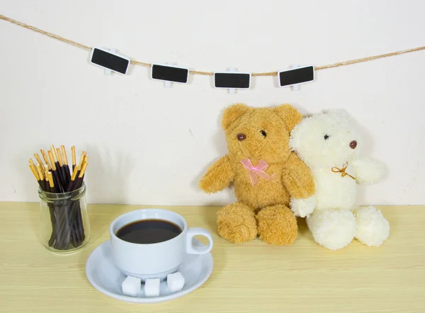 Still life with clothesline on wooden table over grunge backgrou — Stock Photo, Image