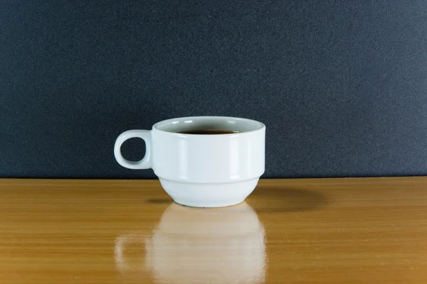 Still life white cup of coffee on wooden table — Stock Photo, Image