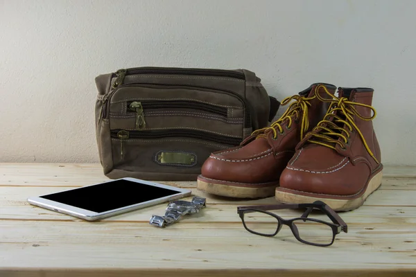 Still life with casual man, boots and bag on wooden table backgr — Stock Photo, Image