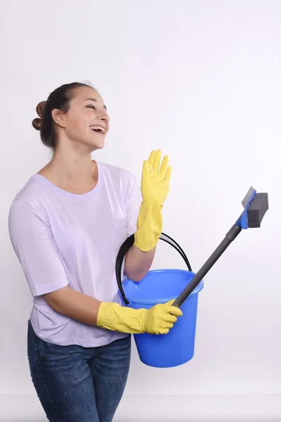 Young housewife holding cleaning products. — Stock Photo, Image