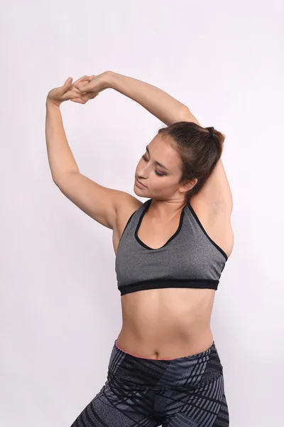 Athlete young woman doing exercise. — Stock Photo, Image