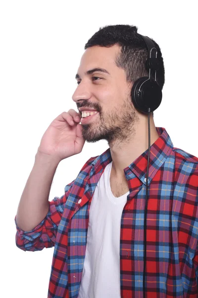 Junger lateinischer Mann hört Musik — Stockfoto