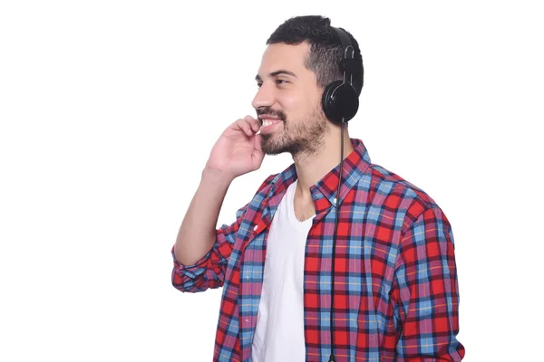 Young latin man listening to music — Stock Photo, Image