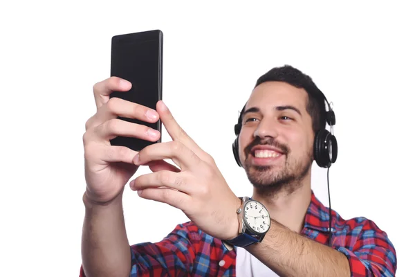 Genç adam onun smartphone ile bir selfie alarak. — Stok fotoğraf