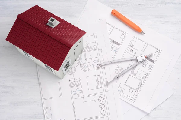 A house with house plan and tools. — Stock Photo, Image