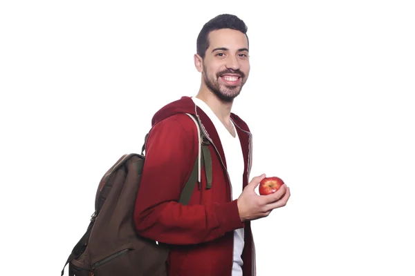 Portrét mladého studentského studenta s jablkem a batohu . — Stock fotografie