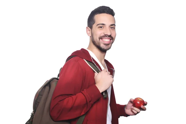 Portrét mladého studentského studenta s jablkem a batohu . — Stock fotografie