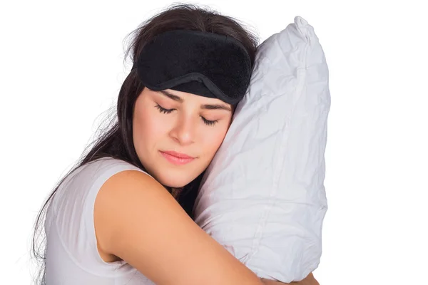 Kobieta nosząca maskę snu i trzymająca poduszkę. — Zdjęcie stockowe