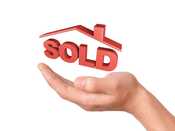 Hand bedrijf verkocht huis geïsoleerd op witte achtergrond — Stockfoto