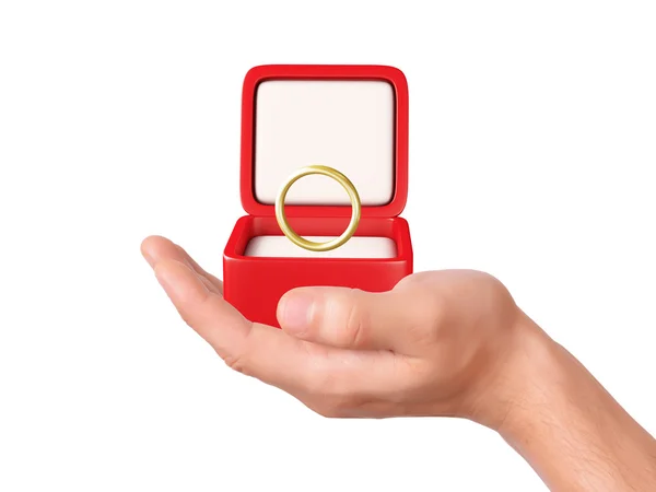 Mão segurar uma caixa de presente com anel de casamento — Fotografia de Stock
