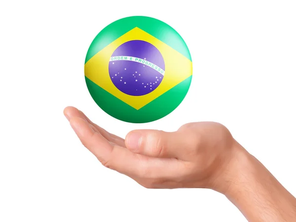 Mano tenere icona bandiera brasiliana su bakground bianco — Foto Stock