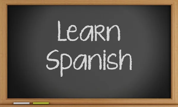 Leer Spaans geschreven op blackboard. — Stockfoto