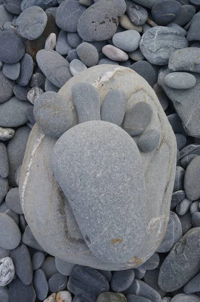 Foot made out of pebblestones