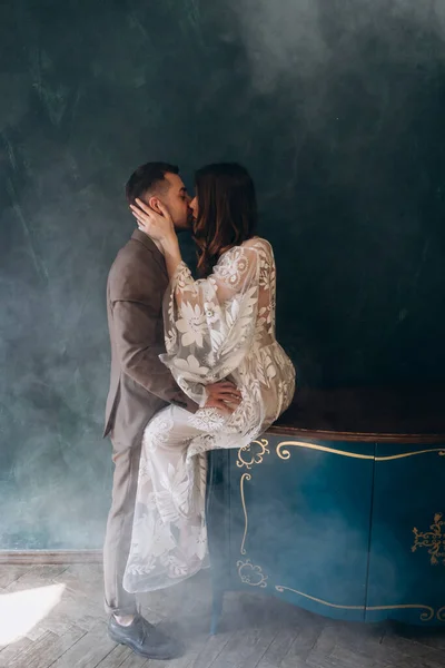 Young Groom Hugging Kissing His Beautiful Bride Dressed White Bohemian — Stock Photo, Image