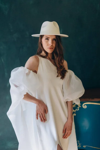 Girl Beautiful White Sensual Dress White Hat Standing Blue Room — Stock Photo, Image