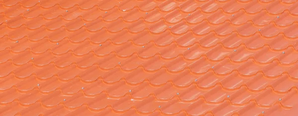 Arancio piastrelle tetto sfondo — Foto Stock