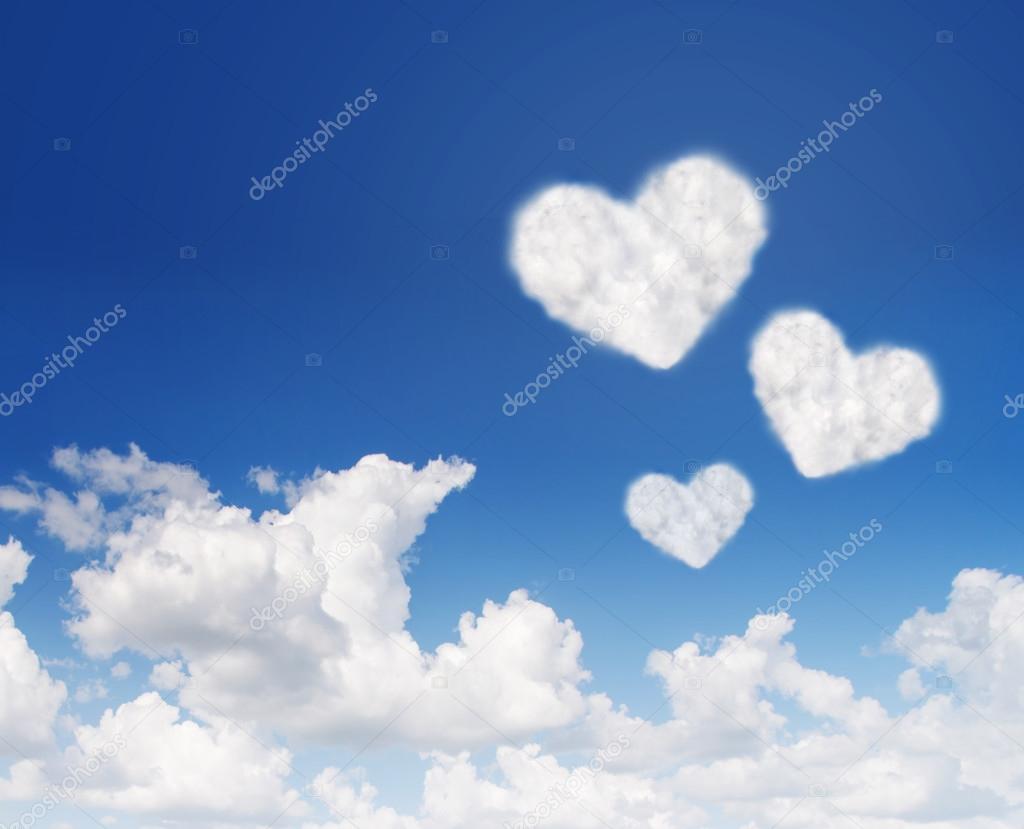 blue sky with hearts shape clouds. Love concept 