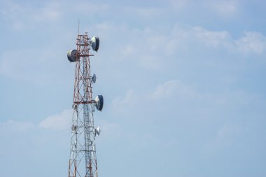 Telecommunication tower with blue sky background. clipart