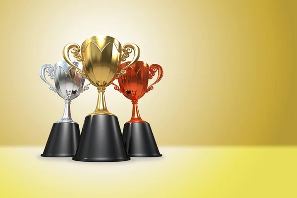 3D rendering gold, silver and bronze  awards winners cup sitting — Stock Photo, Image