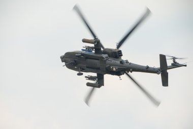 A RAF Apache attack helicopter in flight clipart