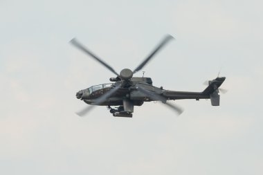 A RAF Apache attack helicopter in flight clipart
