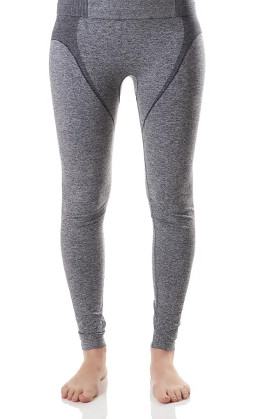 View of fit woman legs standing straight in gray sports thermal underwear with pattern. — Stock Photo, Image