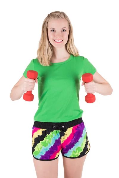 Jonge vrouw doen oefening met rode halters in sportkleding. — Stockfoto