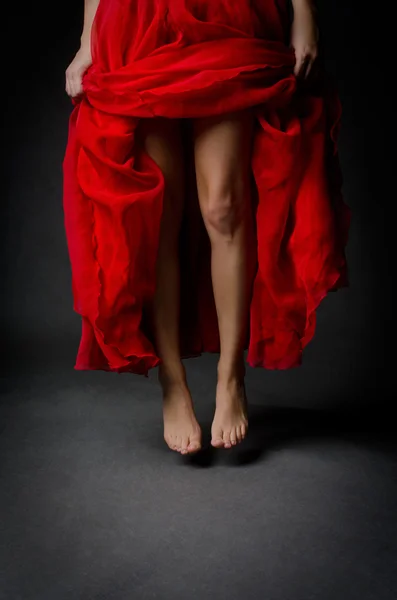 Beautiful legs and red skirt — Stock Photo, Image