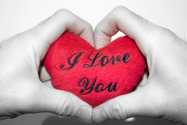 Two hands holding a heart that says "I Love You" — Stock Photo, Image