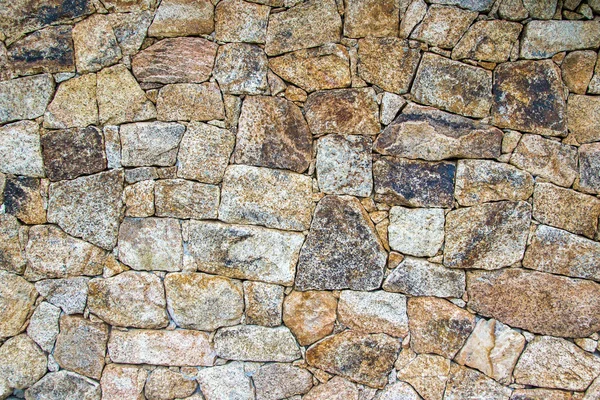 Wall of irregular stones — Stock Photo, Image