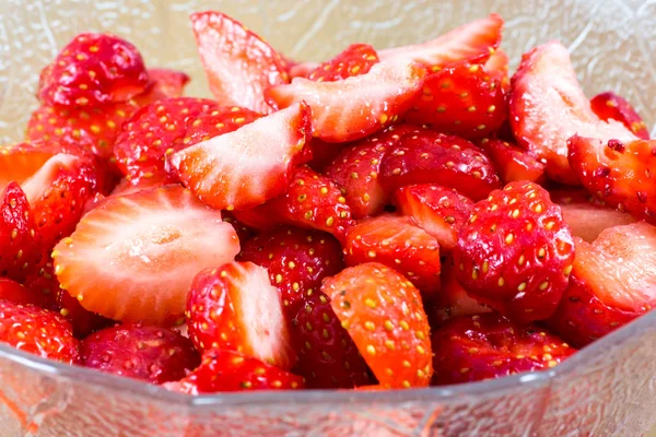 Garden strawberries sliced in a cup — Stock Photo, Image