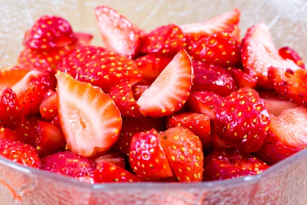 Garden strawberries sliced in a cup — Stock Photo, Image