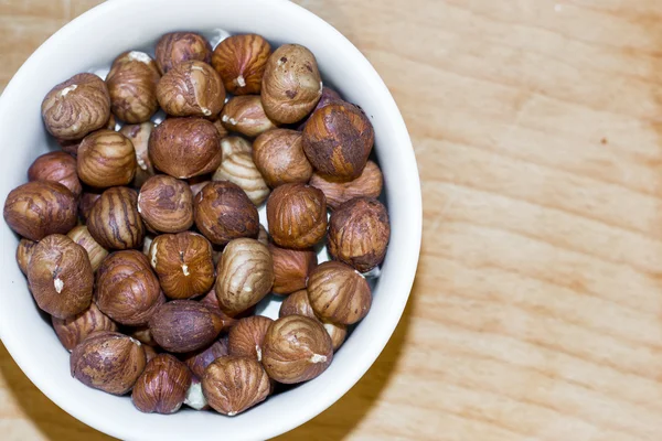 Shelled Hazelnuts in a bowl — Stock Photo, Image