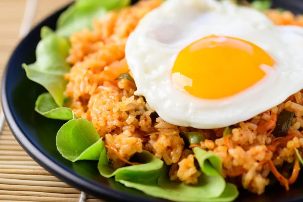 Korean food, Kimchi fried rice with fried egg on top, Close up