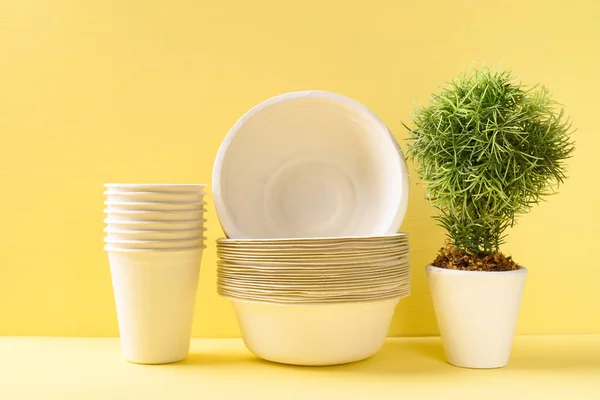 Biodegradable, Compostable, Disposable or Eco friendly utensil bowl and cup on yellow background, Sustainable concept
