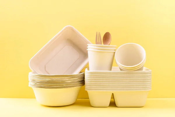 Biodegradable, Compostable, Disposable or Eco friendly utensil (dish, bowl, cup) on yellow background, Sustainable concept