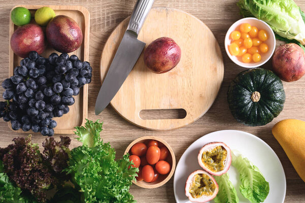 Fresh fruits and vegetables preparing for vegan food cooking on wooden table, Healthy eating, Table top view