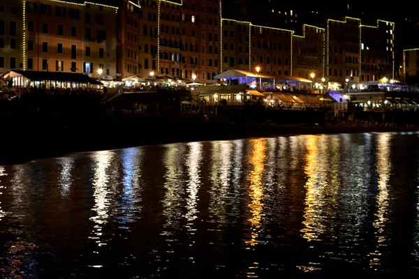 night lights reflected on the sea at night