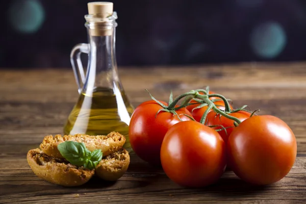 Fresh olive oil ,baguettes, tomatoes — Stock Photo, Image
