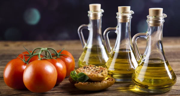 Fresh olive oil ,baguettes, tomatoes — Stock Photo, Image